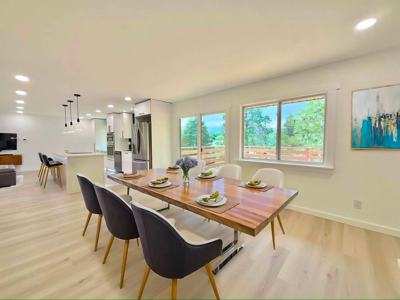 Dining area with large windows and new light flooring