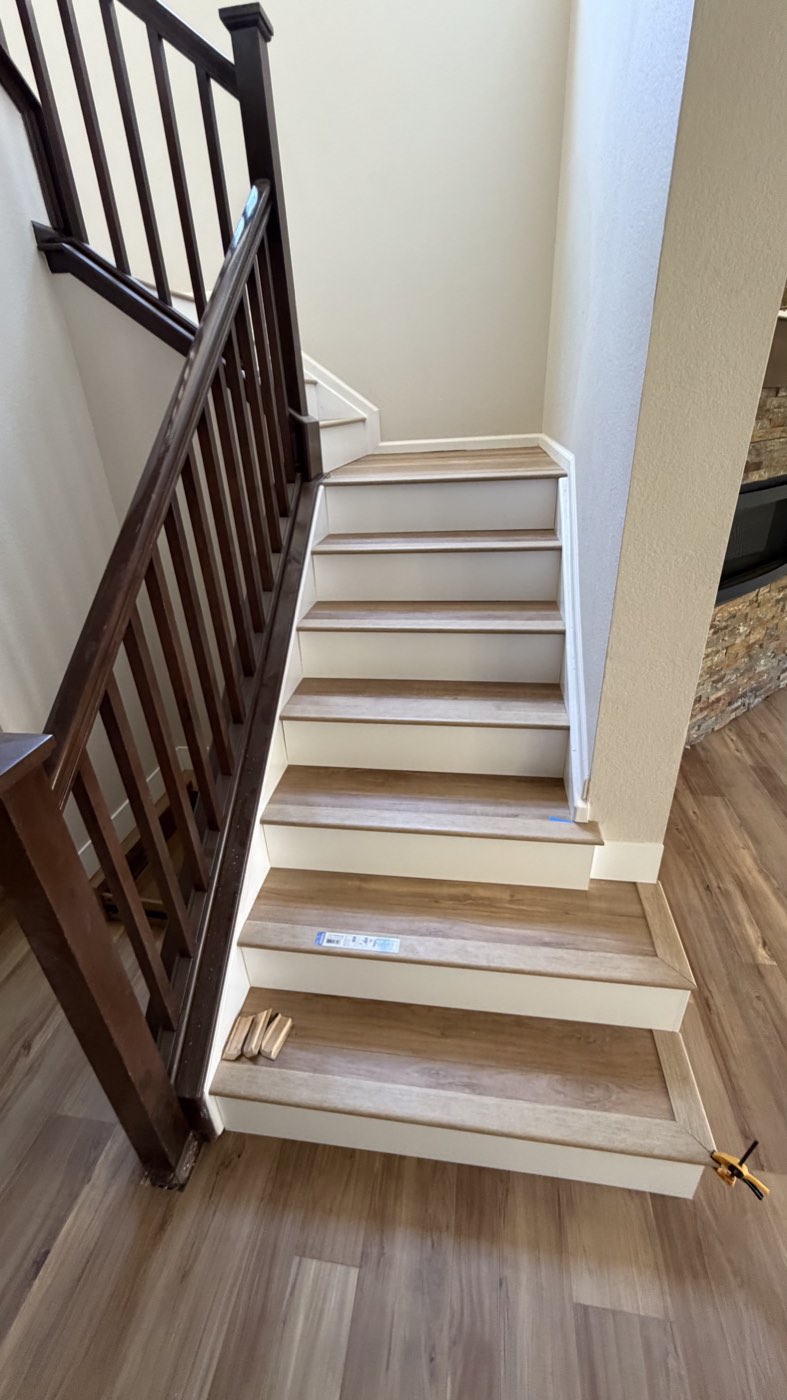 Refinished staircase with dark wood balusters