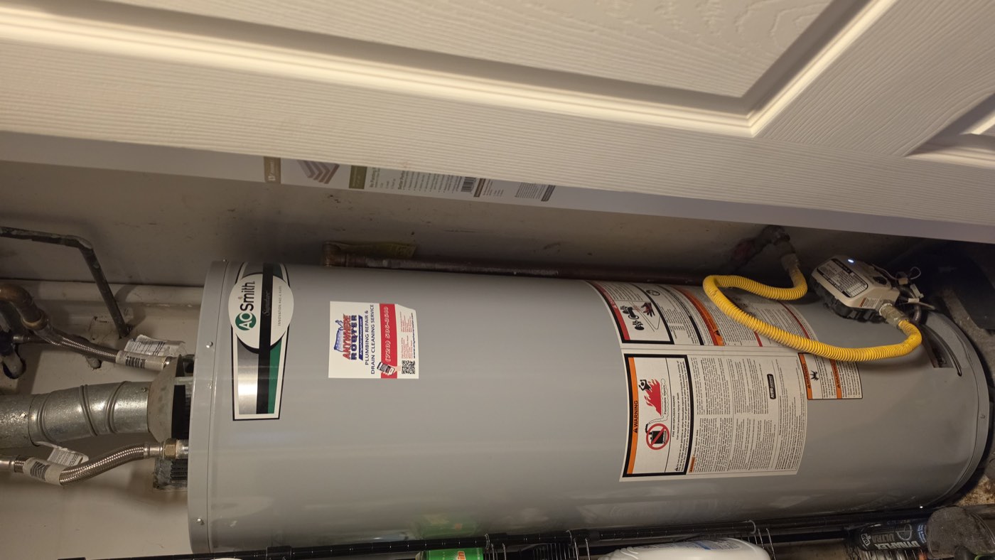 Gas water heater installed in a utility closet with new water lines